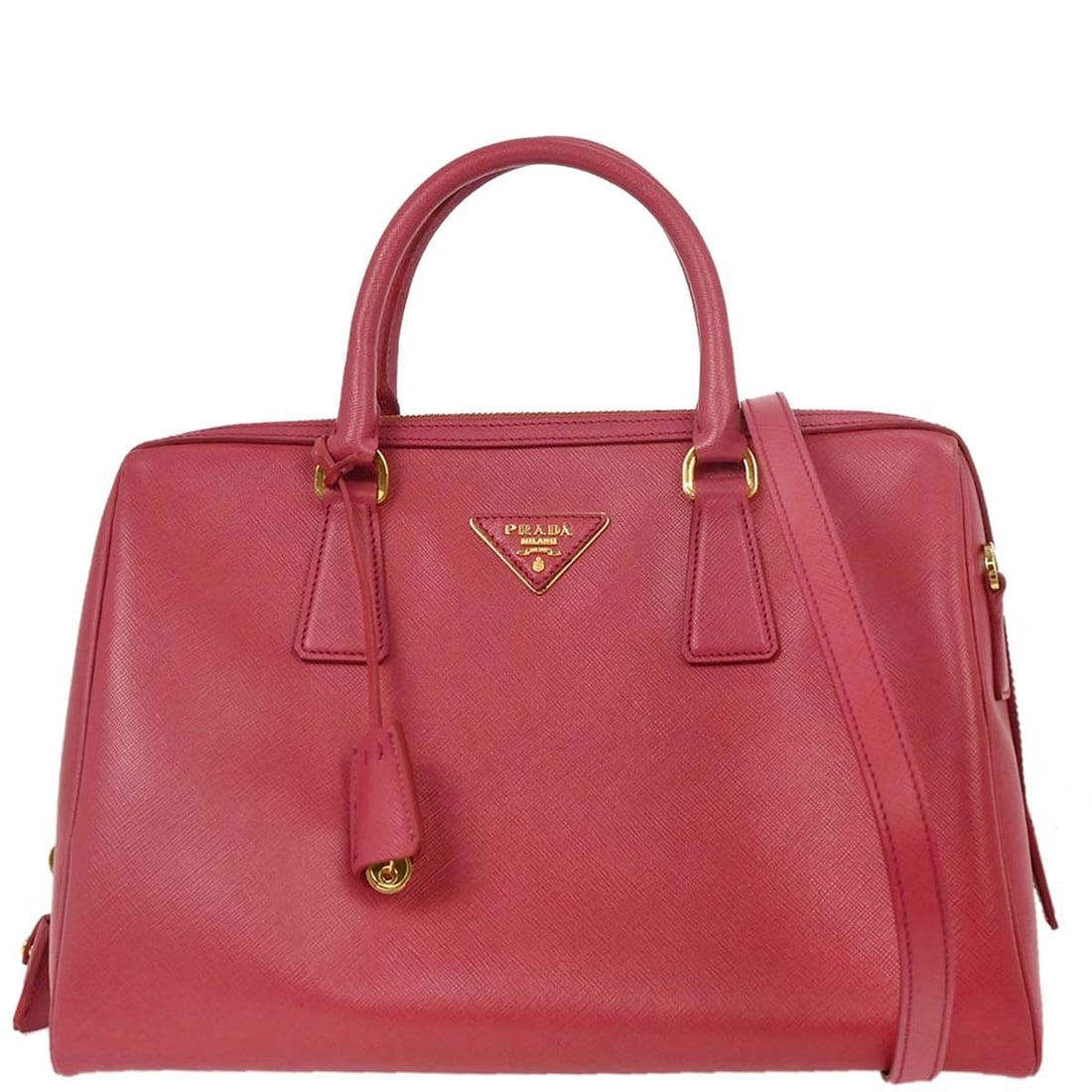 Prada Pink Leather 2way Duffle Handbag 12/113: Prada Pink Leather 2way Duffle Handbag 12/113 This stylish Prada handbag is crafted from high-quality pink leather, showcasing a chic duffle style perfect for casual occasions. It features the iconic 