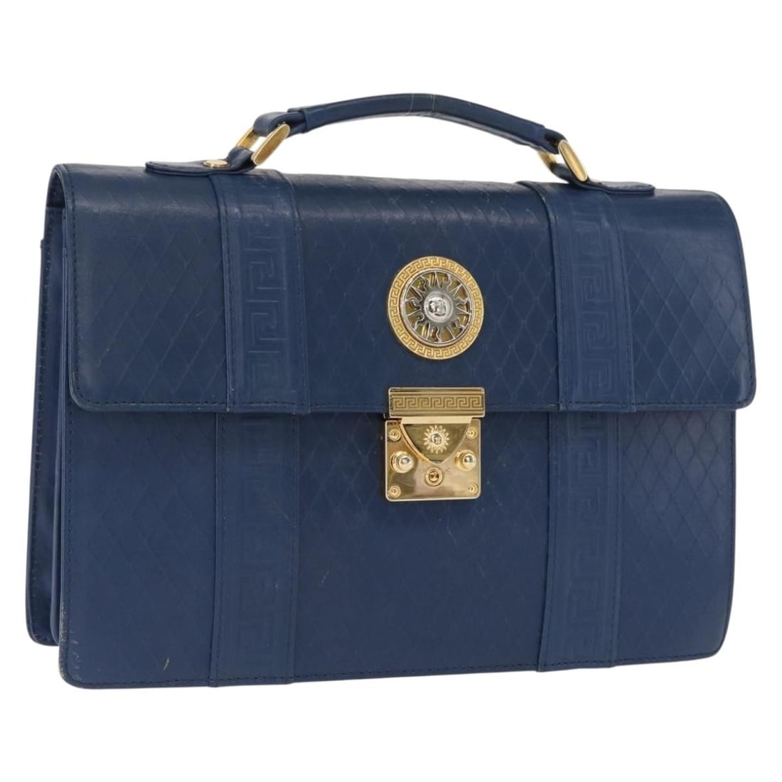Blue and Gold Leather Versace Handbag Made in Italy: Blue and Gold Leather Versace Handbag Made in Italy This Versace handbag is crafted from blue and gold leather and made in Italy. The bag features a structured silhouette with a top handle. The condit