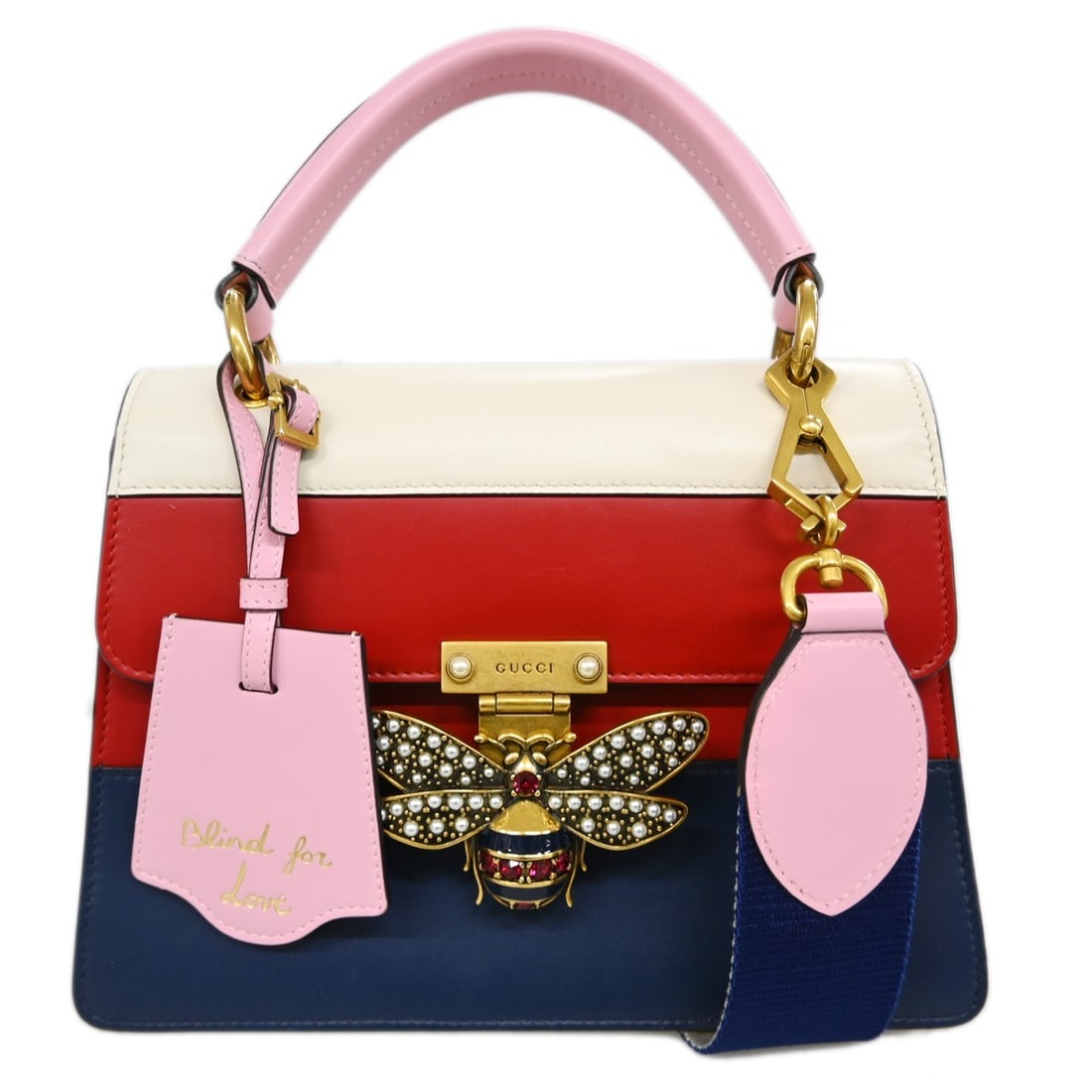 Red Leather Queen Margaret Top Handle Bag by Gucci: Red Leather Queen Margaret Top Handle Bag by Gucci This Gucci Queen Margaret handbag is crafted from red leather and features a medium-sized top handle design. The bag offers versatile carrying option