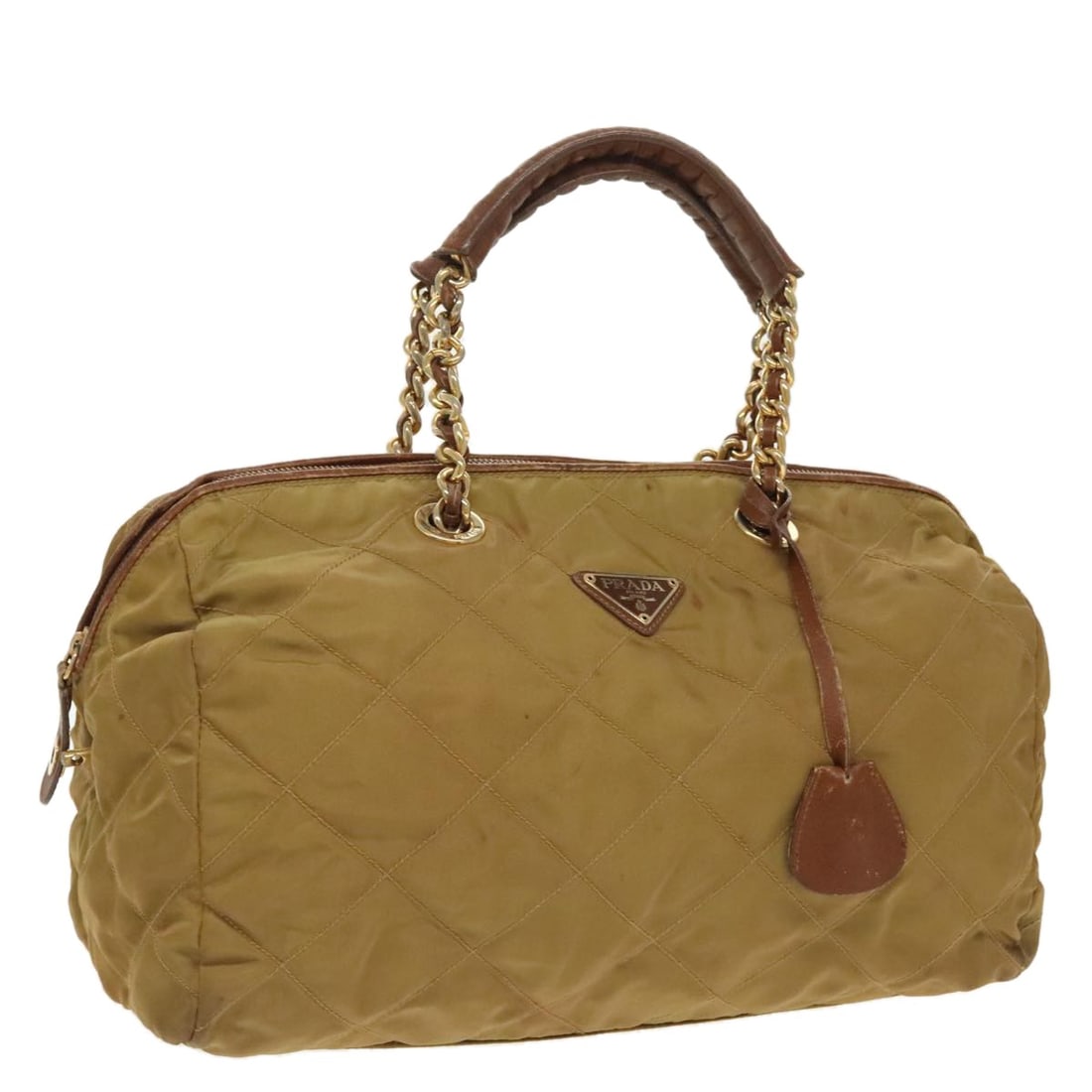 Prada Beige Nylon Handbag with Chain Strap and Gold Accents: Prada Beige Nylon Handbag with Chain Strap and Gold Accents This PRADA chain handbag is crafted from beige nylon with gold-tone accents. Designed for women, it features a practical top handle with a d