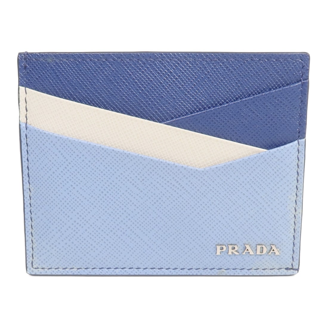 Blue and White Calfskin Card Holder by PRADA: Blue and White Calfskin Card Holder by PRADA This Prada card case is crafted from blue calfskin leather and designed for women. It features a compact and stylish design, ideal for organizing cards. Ma