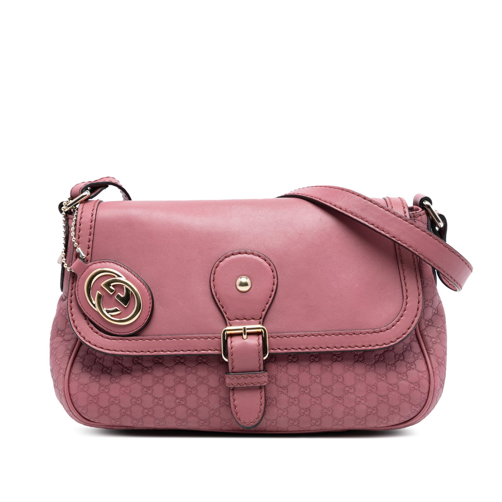 Pink Gucci Microguccissima Sukey Embossed Leather Crossbody Bag: Pink Gucci Microguccissima Sukey Embossed Leather Crossbody Bag The Gucci Microguccissima Sukey Crossbody is crafted from embossed pink leather and features an adjustable flat leather strap. It is des