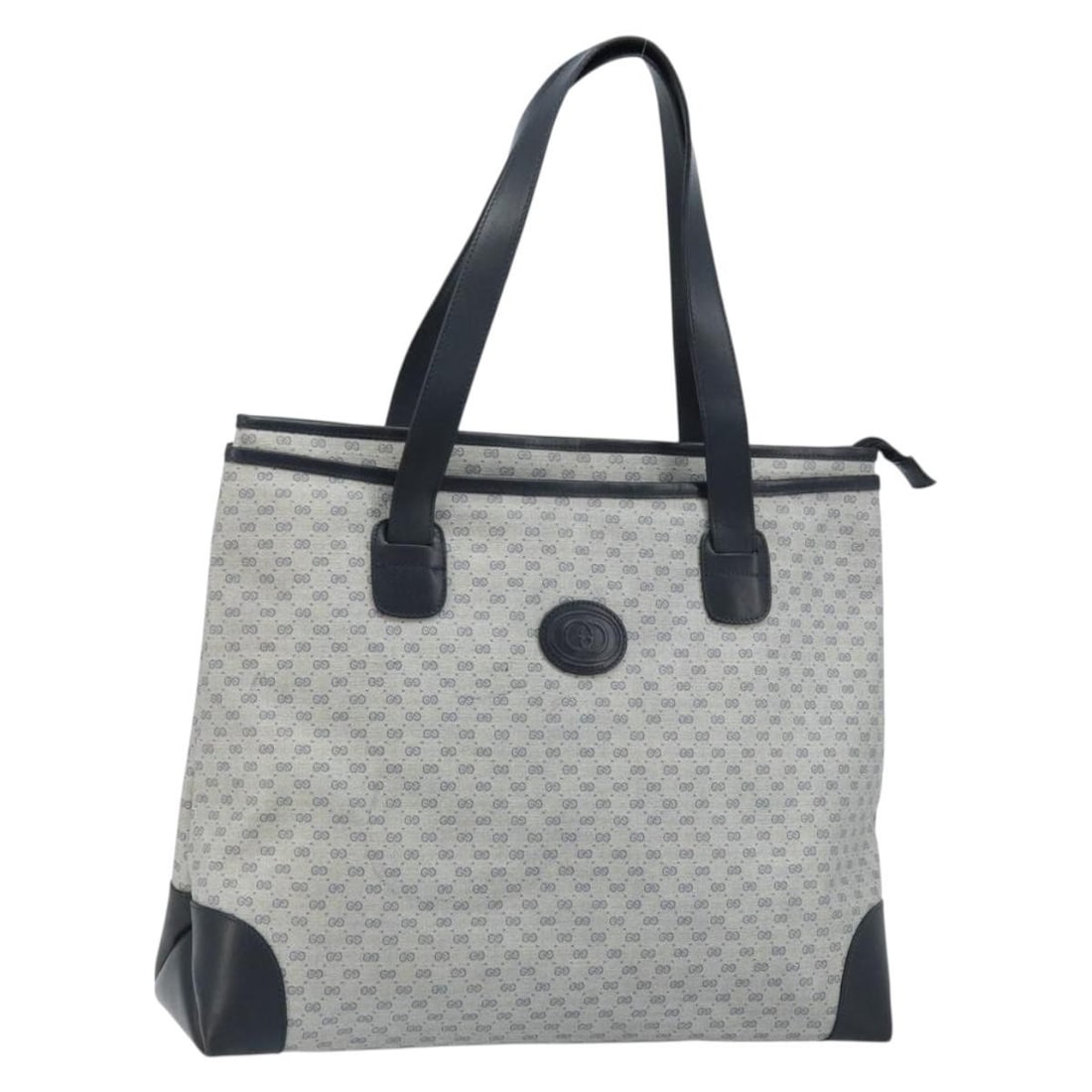 Gucci Micro GG Supreme Navy PVC Leather Tote Bag Gold Accents: Gucci Micro GG Supreme Navy PVC Leather Tote Bag Gold Accents This GUCCI Micro GG Supreme tote bag features a navy and gold color scheme with PVC leather and micro small GG canvas for the exterior. De
