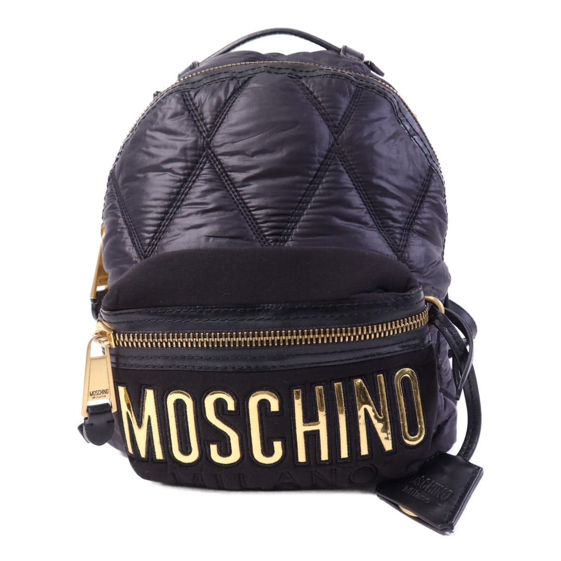 Moschino Black Nylon Backpack with Gold Hardware B76058: Moschino Black Nylon Backpack with Gold Hardware B76058 This MOSCHINO rucksack backpack features a durable black nylon exterior and is designed for women. With a classic rucksack style, it offers prac