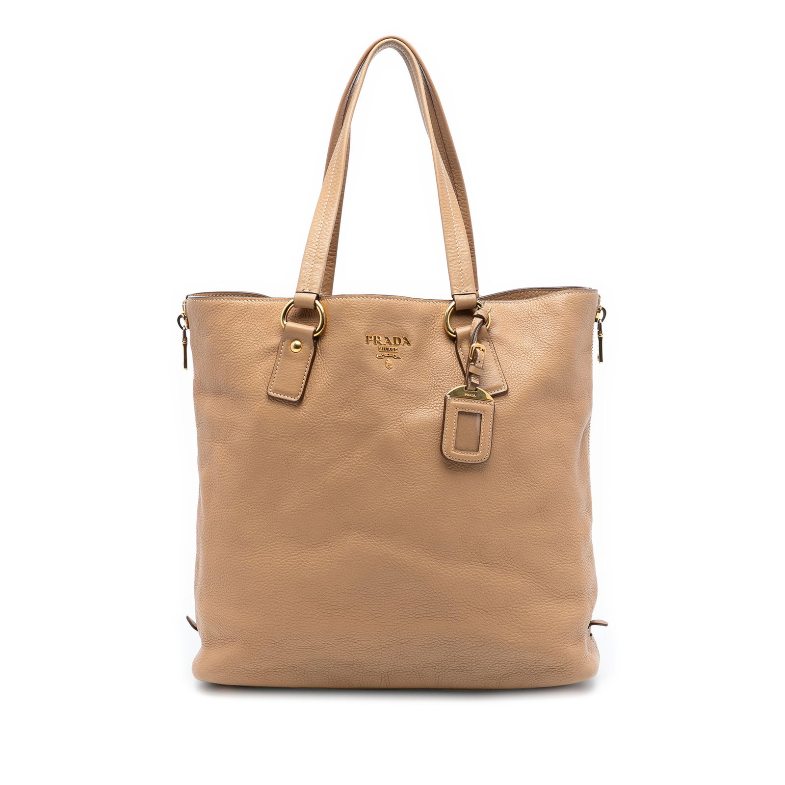 Prada Vitello Daino Beige Leather Tote with Side Zipper Expansions: Prada Vitello Daino Beige Leather Tote with Side Zipper Expansions This Prada Vitello Daino Side Zip Shopper Tote is crafted from beige leather and features flat leather handles, side zip expansions f