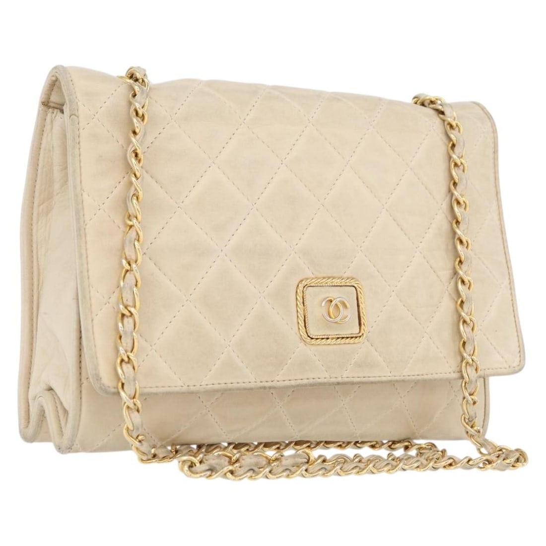 Beige Lambskin Matelasse Shoulder Bag with Gold Chain by CHANEL: Beige Lambskin Matelasse Shoulder Bag with Gold Chain by CHANEL This CHANEL Matelasse shoulder bag is crafted from beige lambskin leather and features the iconic gold-tone CC hardware. Designed for wo