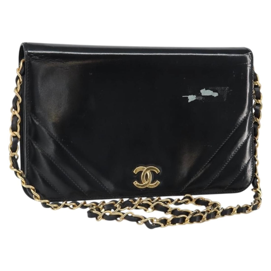 Black Patent Leather Chain Shoulder Bag by CHANEL Gold CC France: Black Patent Leather Chain Shoulder Bag by CHANEL Gold CC France This CHANEL chain shoulder bag is crafted from black patent leather with gold-tone accents. It features a classic shoulder bag style wi