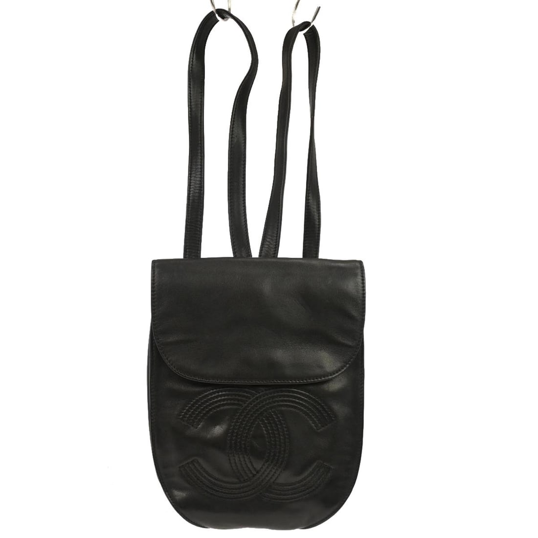Small Black Leather Backpack with Logo Accents by Chanel: Small Black Leather Backpack with Logo Accents by Chanel This Chanel black lambskin backpack features a compact design with the brand's signature logo accent. Made from leather, it offers inner pocket
