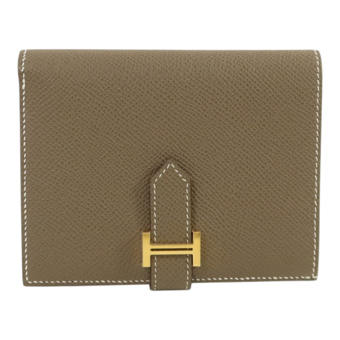 Bearn Compact Bi-fold Wallet Epsom Leather Etoupe with Gold Hardware: Bearn Compact Bi-fold Wallet Epsom Leather Etoupe with Gold Hardware This Hermes Bearn Compact wallet features a bi-fold design crafted from Epsom calfskin leather in a sophisticated gray tone. Design