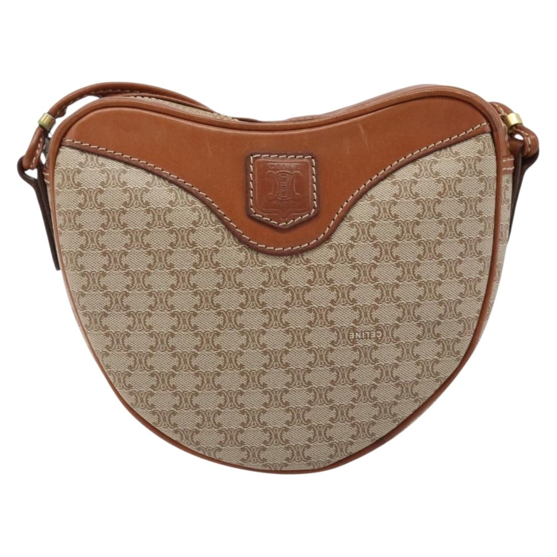Celine Macadam Beige Canvas and Leather Vintage Shoulder Bag: Celine Macadam Beige Canvas and Leather Vintage Shoulder Bag This Celine Vintage Macadam shoulder bag features a classic beige canvas exterior paired with leather accents. Designed for women, the bag 