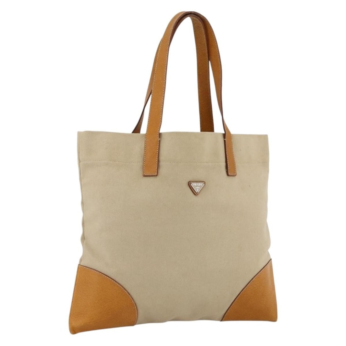 Beige and Silver Canvas Tote PRADA Women's Bag Italy: Beige and Silver Canvas Tote PRADA Women's Bag Italy This is a PRADA women's tote bag made from beige and silver canvas. The bag is designed with a spacious main compartment and features dual handles 