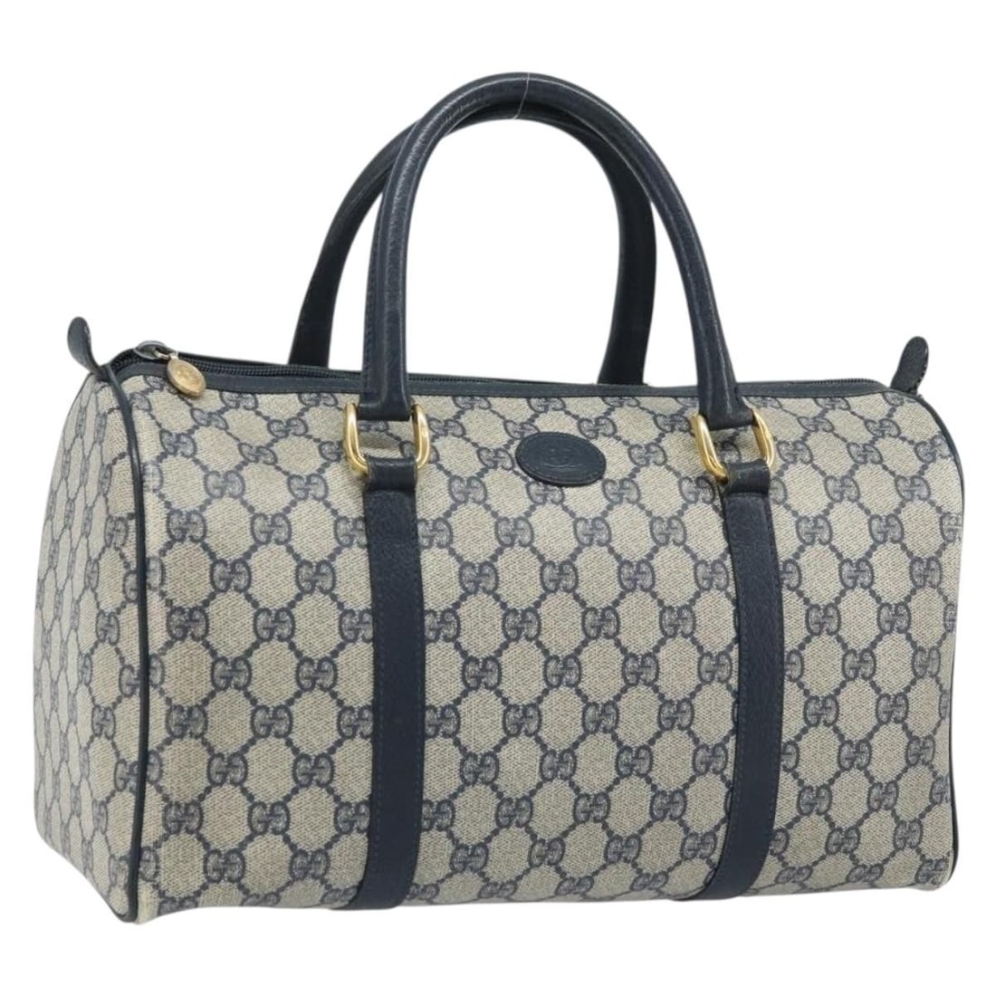 Gucci GG Supreme Navy PVC Leather Handbag Model 002 39 6842: Gucci GG Supreme Navy PVC Leather Handbag Model 002 39 6842 This Gucci GG Supreme hand bag features a navy and gold color scheme with PVC leather and GG canvas exterior materials. The bag is designed 