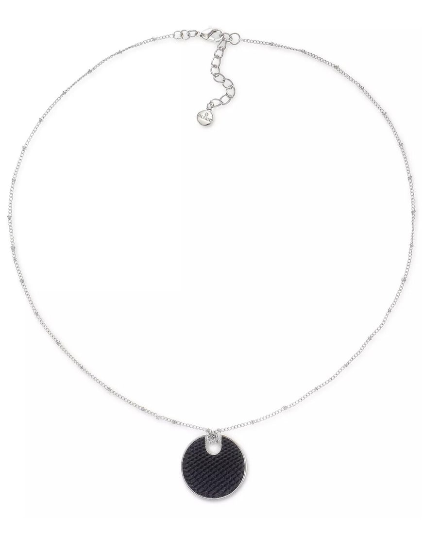 Macy's Silver-Tone Long Pendant Necklace with Faux-Leather Circle: Macy's Silver-Tone Long Pendant Necklace with Faux-Leather Circle Elevate your accessory collection with this stylish long pendant necklace featuring a chic faux-leather circle pendant. Crafted from s