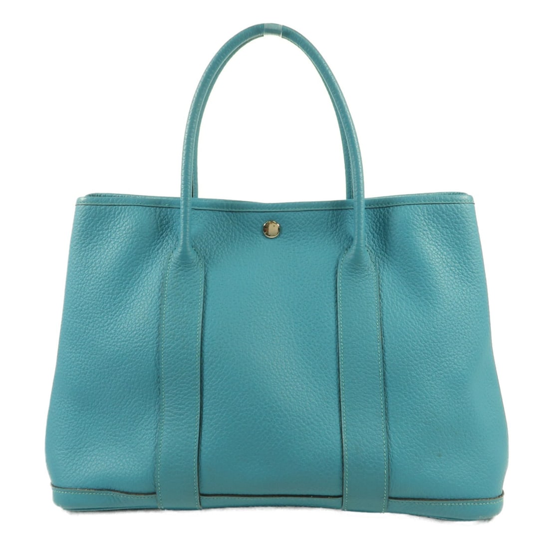 HERMES Garden Party PM Tote Bag Blue Calfskin PHW: HERMES Garden Party PM Tote Bag Blue Calfskin PHW This exquisite HERMES Garden Party PM Tote Bag is crafted from premium calfskin (cowhide) in a stunning Blue Zanzibar color. The bag features a spacio