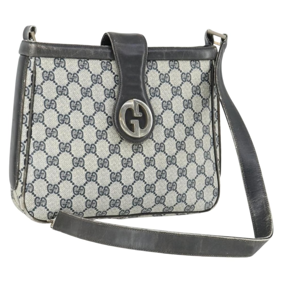 Navy GG Supreme Shoulder Bag by Gucci PVC Leather Italian Made: Navy GG Supreme Shoulder Bag by Gucci PVC Leather Italian Made This is a Gucci GG Supreme shoulder bag crafted from navy PVC leather and GG canvas. The bag features a structured silhouette with a sing