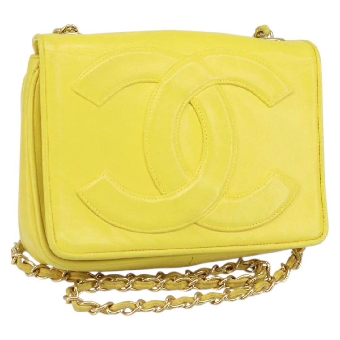 Chanel Lambskin Yellow Gold Shoulder Bag with Chain and CC Logo: Chanel Lambskin Yellow Gold Shoulder Bag with Chain and CC Logo This CHANEL chain shoulder bag features yellow lambskin leather with gold-tone accents and the signature CC logo. The bag has a compact 