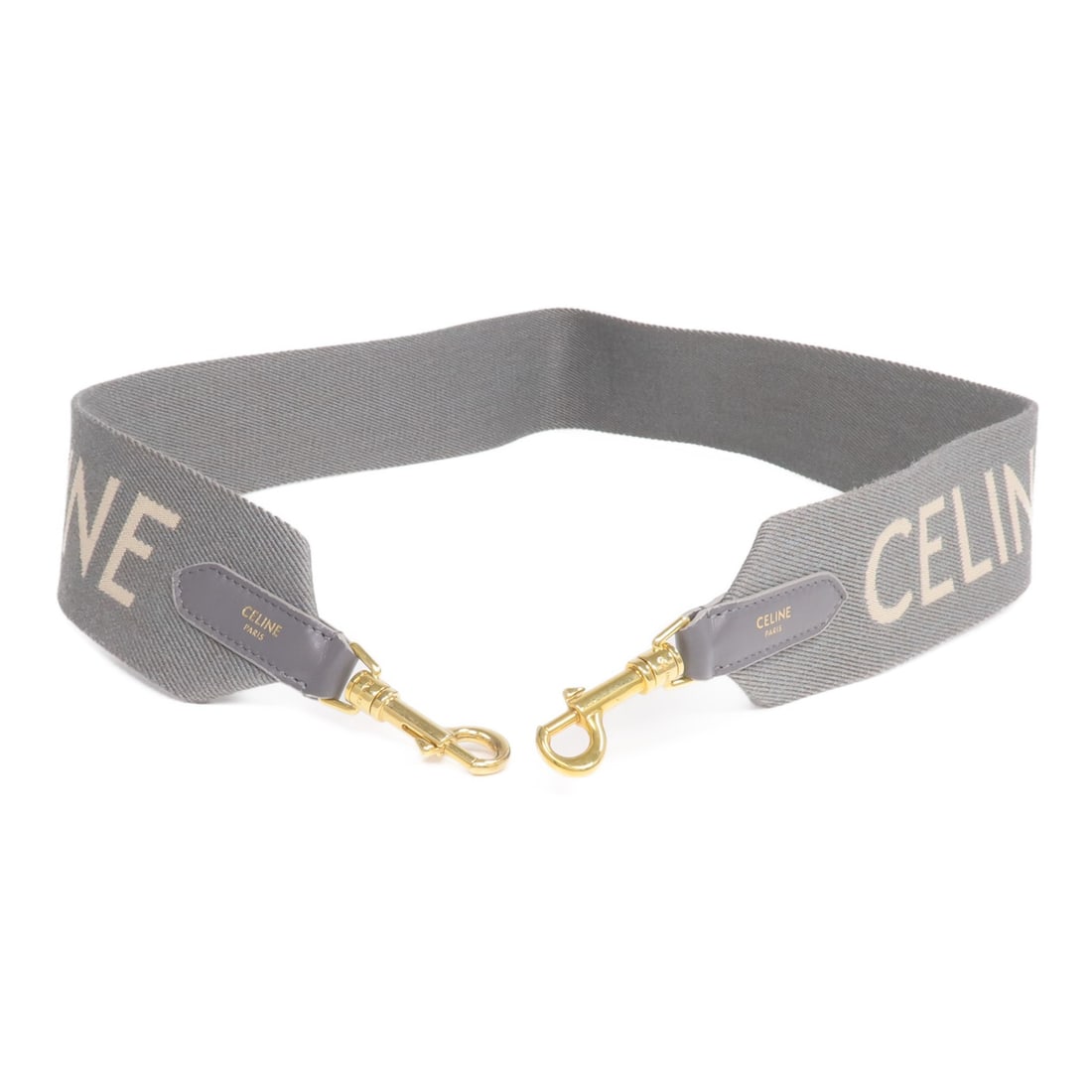 Celine Canvas Gray Shoulder Strap with Gold Hardware: Celine Canvas Gray Shoulder Strap with Gold Hardware This CELINE shoulder strap is crafted from durable gray canvas and designed for unisex use. Made in France, it features gold-tone hardware and is i