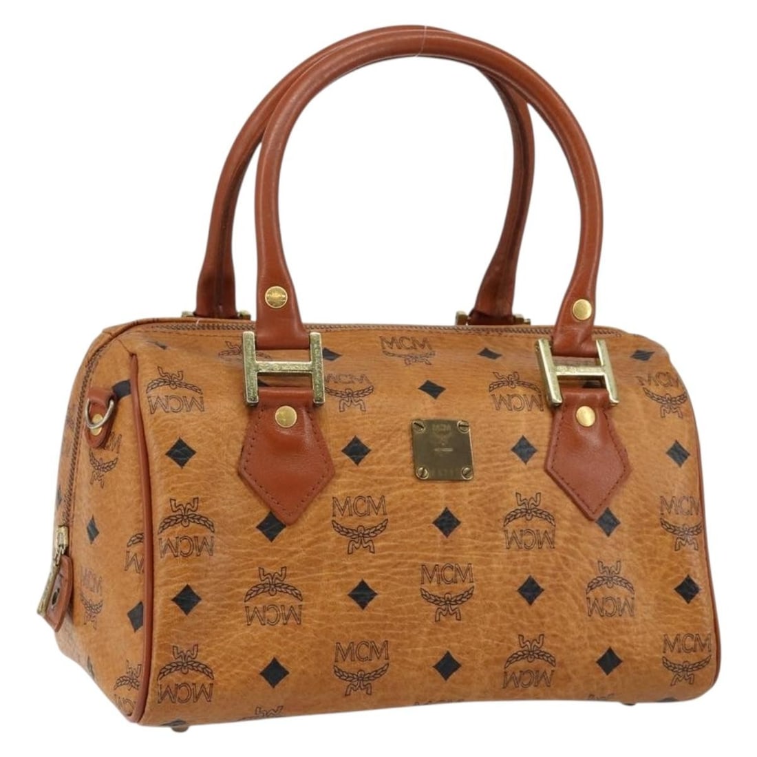 MCM Logogram Vicetos Boston Bag PVC Leather Brown Gold Made in Germany: MCM Logogram Vicetos Boston Bag PVC Leather Brown Gold Made in Germany This authentic MCM Logogram Vicetos Boston Bag features a stylish blend of brown and gold PVC leather, making it a chic addition 