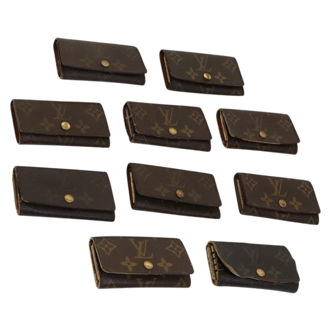 Monogram Canvas Key Holder Set by Louis Vuitton: Monogram Canvas Key Holder Set by Louis Vuitton This Louis Vuitton monogram key case is crafted from monogram canvas and is designed for women. The item shows significant signs of use, including shape