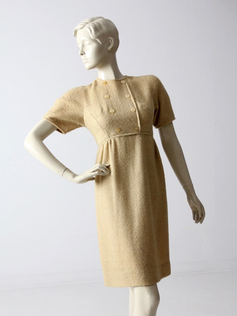 1960s Vintage Tweed Wiggle Dress Empire Waist Gold Wool: 1960s Vintage Tweed Wiggle Dress Empire Waist Gold Wool Step back in time with this stunning 1960s vintage tweed wiggle dress. Crafted from a luxurious golden tweed wool, this dress features an elegan