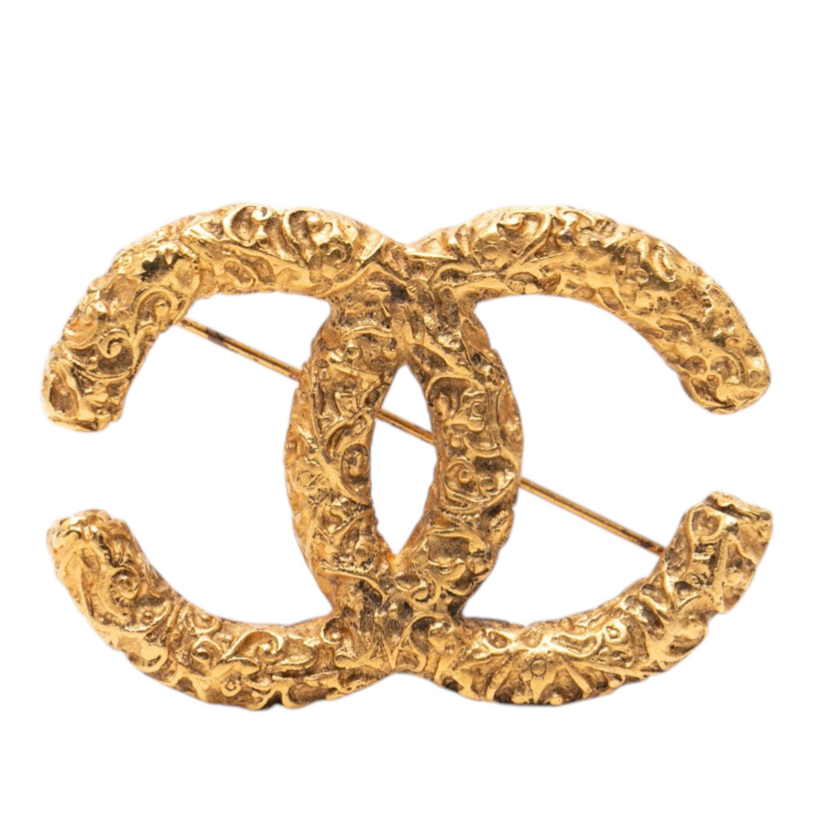 Chanel CC Embossed Logo Gold Plated Metal Brooch Pin: Chanel CC Embossed Logo Gold Plated Metal Brooch Pin This Chanel brooch showcases an embossed CC logo on a gold plated metal body and features a back pin closure. The piece is classified as costume je