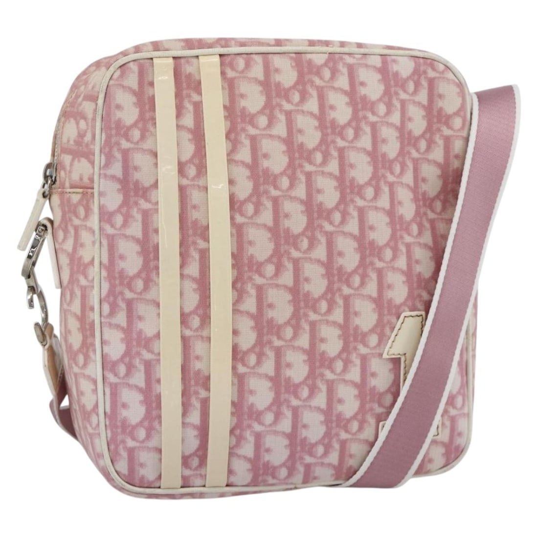 Christian Dior Pink Trotter Canvas and PVC Leather Shoulder Bag with Guarantee Card: Christian Dior Pink Trotter Canvas and PVC Leather Shoulder Bag with Guarantee Card This Christian Dior Trotter Canvas shoulder bag features a pink and silver colorway with PVC leather and Trotter can