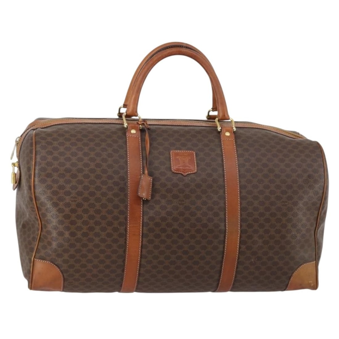 CELINE Brown PVC Leather Macadam Boston Bag with Accessories: CELINE Brown PVC Leather Macadam Boston Bag with Accessories This CELINE Macadam Canvas Boston Bag combines functionality with luxury, crafted from durable PVC leather and featuring the iconic Macadam