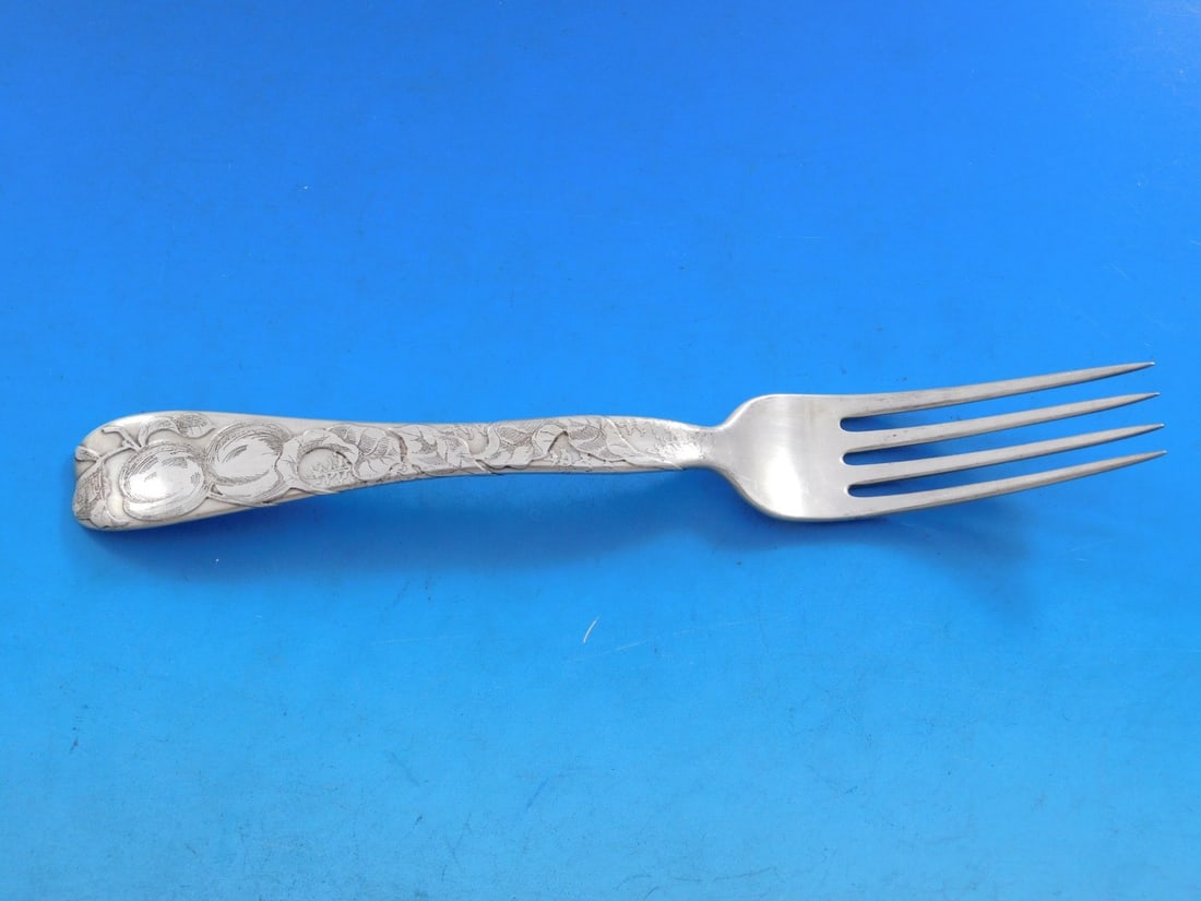 Tiffany Sterling Silver Fork Lap Over Edge Apricot 7 1/4 Inches: Tiffany Sterling Silver Fork Lap Over Edge Apricot 7 1/4 Inches This exquisite fork showcases the 'Lap Over Edge' pattern, acid etched by Tiffany & Co., featuring a charming apricot motif. Crafted fro