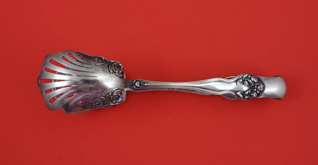 Watson Wedding Rose Sterling Silver Ice Tong Pierced 6 7/8: Watson Wedding Rose Sterling Silver Ice Tong Pierced 6 7/8 This exquisite ice tong, crafted in the elegant Wedding Rose pattern by Watson, showcases a beautiful pierced design. Made from high-quality 