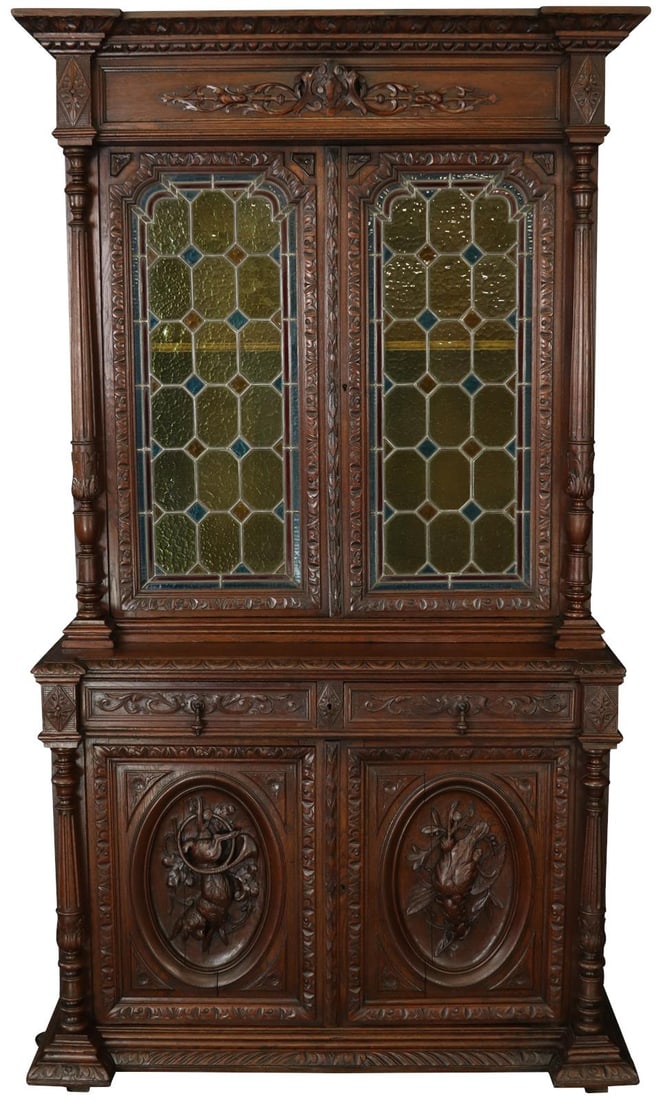 Antique 1900 Handcrafted Oak Sideboard with Glass Doors: Antique 1900 Handcrafted Oak Sideboard with Glass Doors This handcrafted antique sideboard exudes charm and character, showcasing a beautiful stained finish that highlights the natural grain of the oa