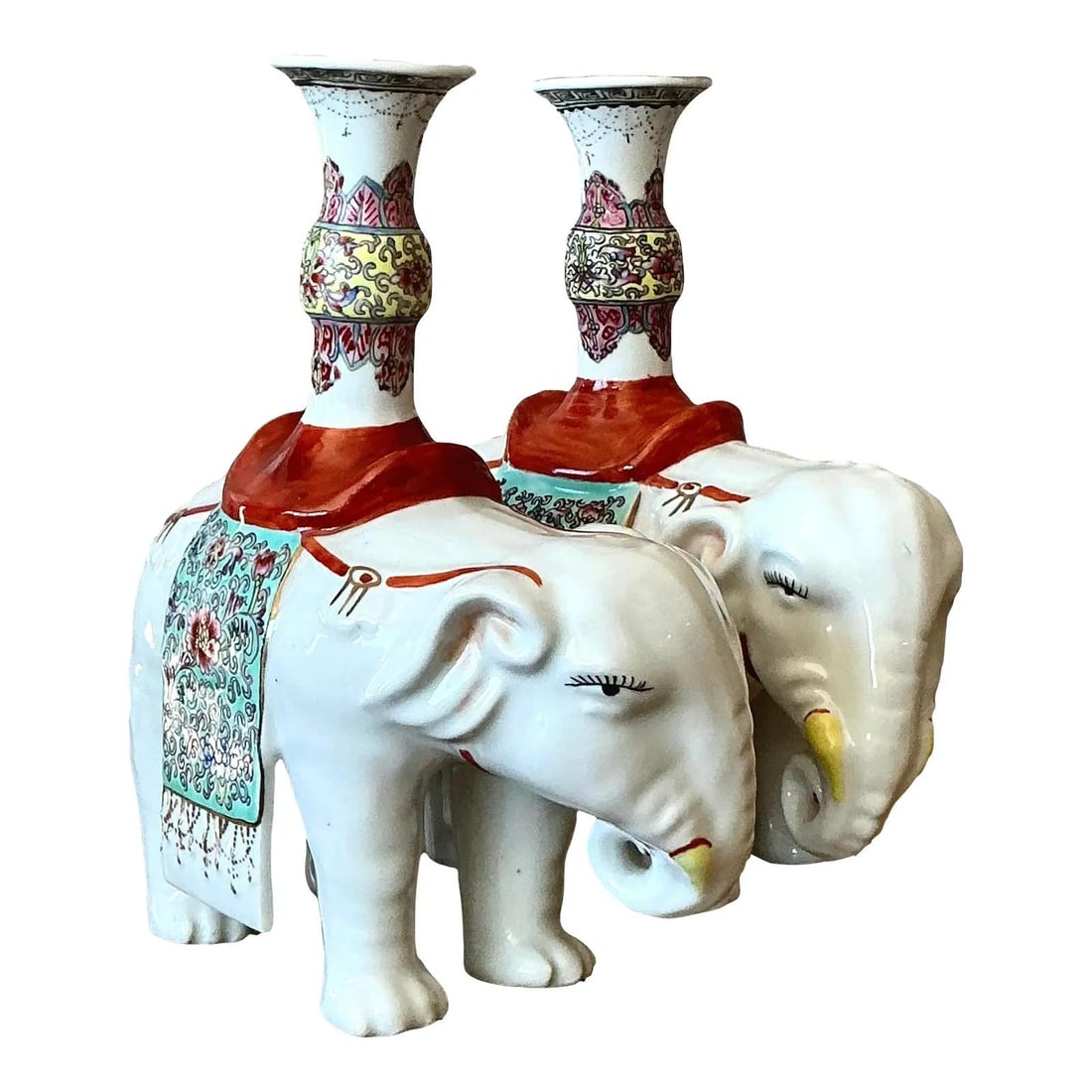 Pair of Chinoiserie White Glazed Ceramic Elephant Candle Holders: Pair of Chinoiserie White Glazed Ceramic Elephant Candle Holders This pair of vintage Asian glazed ceramic elephant candlesticks showcases classic Chinoiserie design. Each elephant is crafted in lustr
