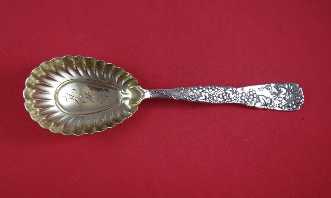 Tiffany & Co Vine Sterling Silver Berry Spoon Gold Wash 9 3/8in: Tiffany & Co Vine Sterling Silver Berry Spoon Gold Wash 9 3/8in This exquisite berry spoon from Tiffany & Co. is crafted from high-quality sterling silver and features a beautiful Vine pattern adorned