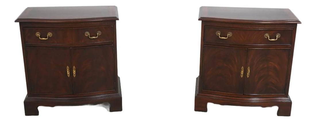 Set of Two Mahogany Chippendale Style Nightstands with Brass Hardware: Set of Two Mahogany Chippendale Style Nightstands with Brass Hardware This pair of Drexel Heritage nightstands features a classic Chippendale style with figural mahogany fronts and brass hardware. Cra