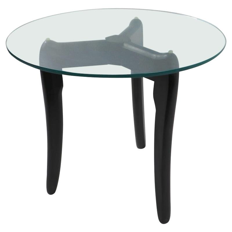 Mid-Century Modern Glass Top Table by Adrian Pearsall: Mid-Century Modern Glass Top Table by Adrian Pearsall This elegantly designed round table features a plate glass top and a sculptural wood base finished in black. The form is attributed to renowned de