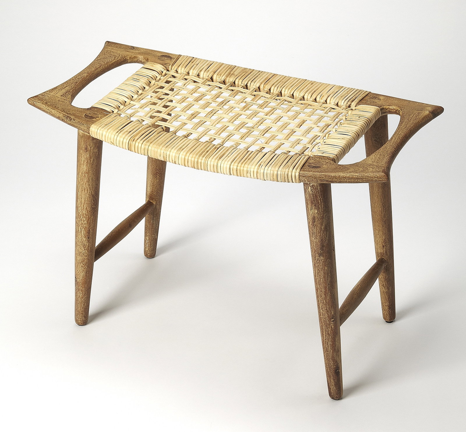 Rectangular Mango Wood Stool with Woven Cane by Butler 17.50H 25.50W 14D: Rectangular Mango Wood Stool with Woven Cane by Butler 17.50H 25.50W 14D This handmade stool features a rectangular design crafted from mango wood with woven cane accents. Its natural mango brown and 