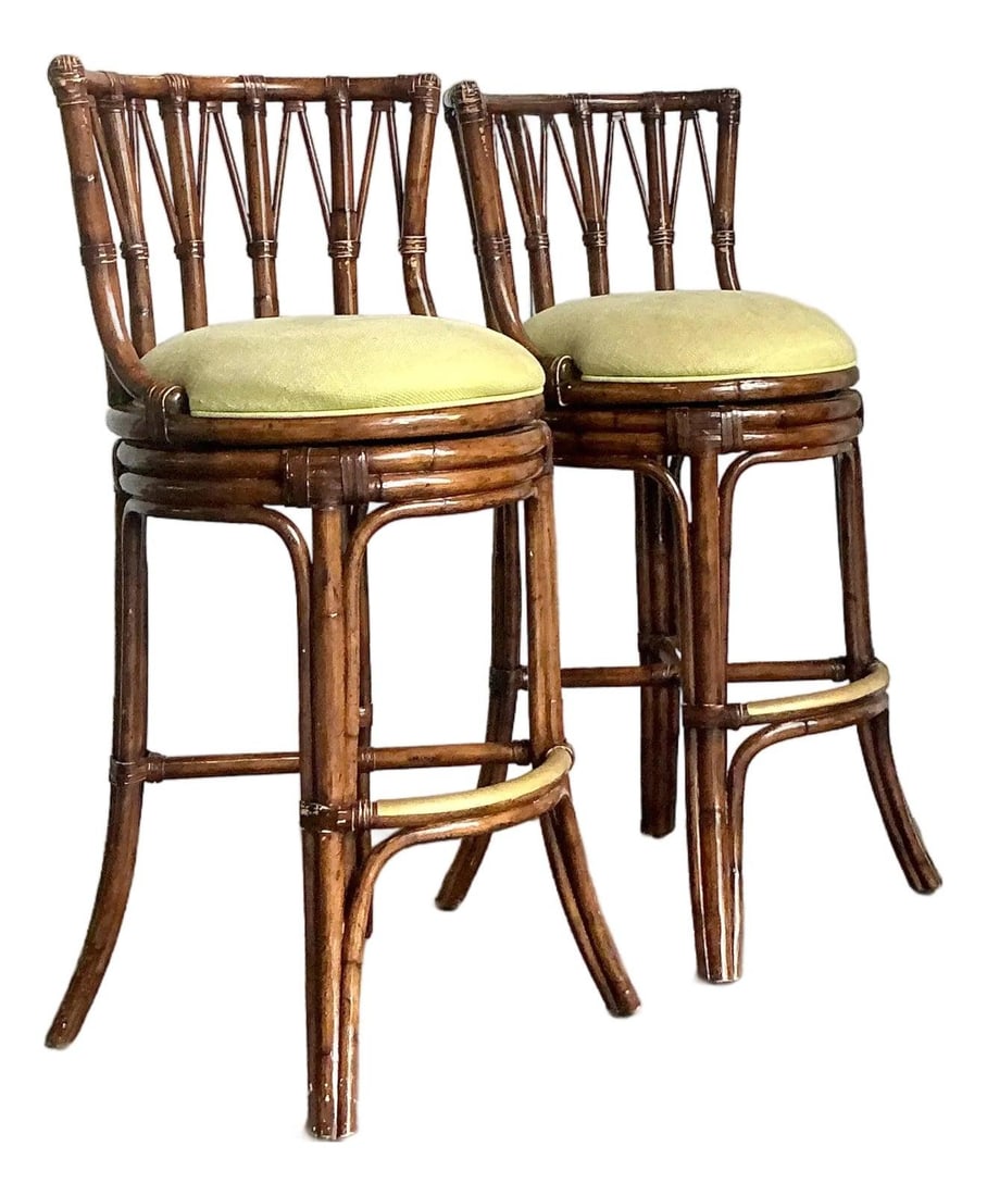Pair of Barrel-Back Rattan Bar Stools with Lattice Backs and Brass Footrests: Pair of Barrel-Back Rattan Bar Stools with Lattice Backs and Brass Footrests This pair of vintage bent rattan bar stools showcases a classic barrel-back silhouette, crafted from sturdy rattan poles wi