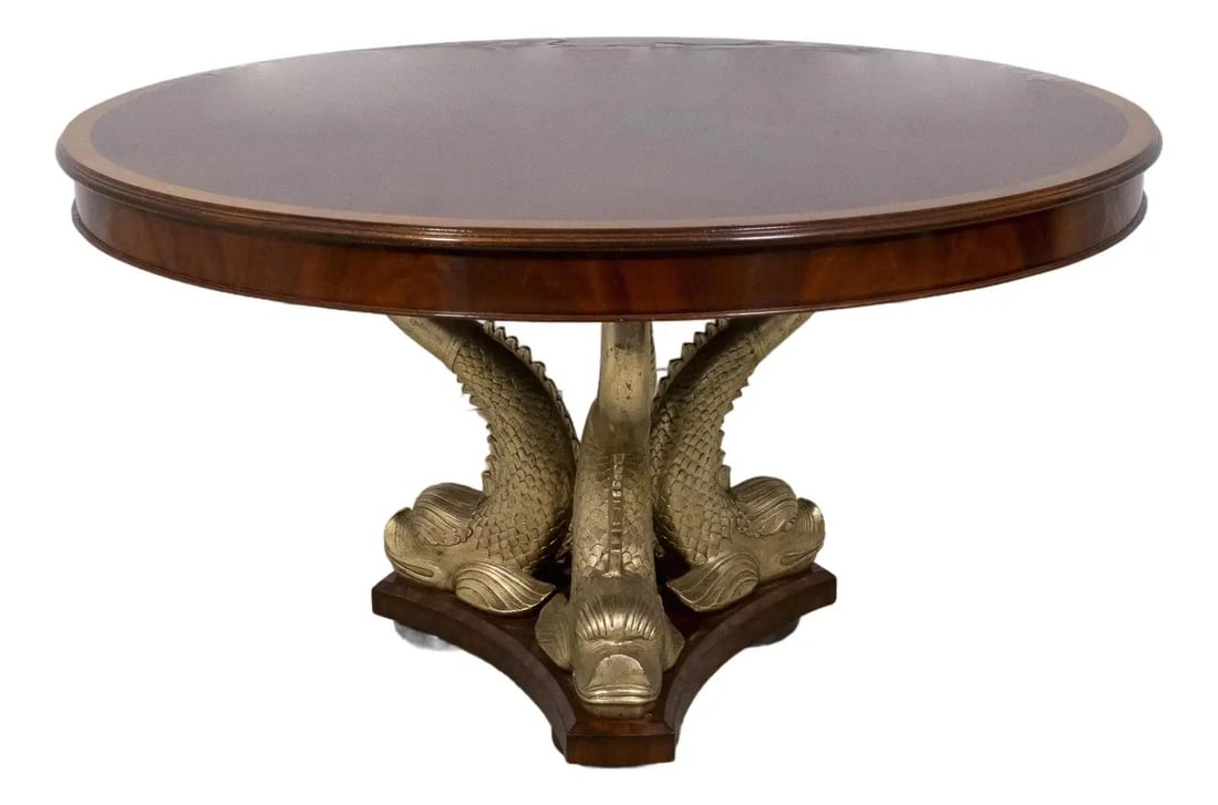 Maitland Smith Mahogany Dining Table with Dolphin Base 54": Maitland Smith Mahogany Dining Table with Dolphin Base 54" This stunning Maitland Smith round dining room center table features a striking dolphin fish base intricately carved from mahogany, complemen