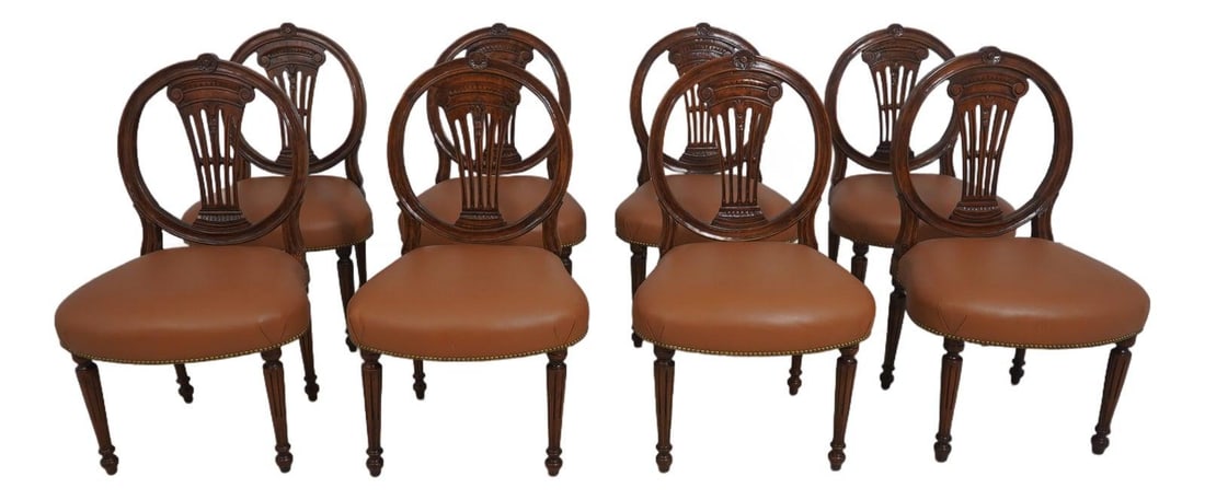 Set of Eight Leather Louis XVI Inspired Dining Chairs with Wide Seats: Set of Eight Leather Louis XVI Inspired Dining Chairs with Wide Seats This set includes eight French Louis XVI style dining room chairs, featuring wide and comfortable seats upholstered in quality bro