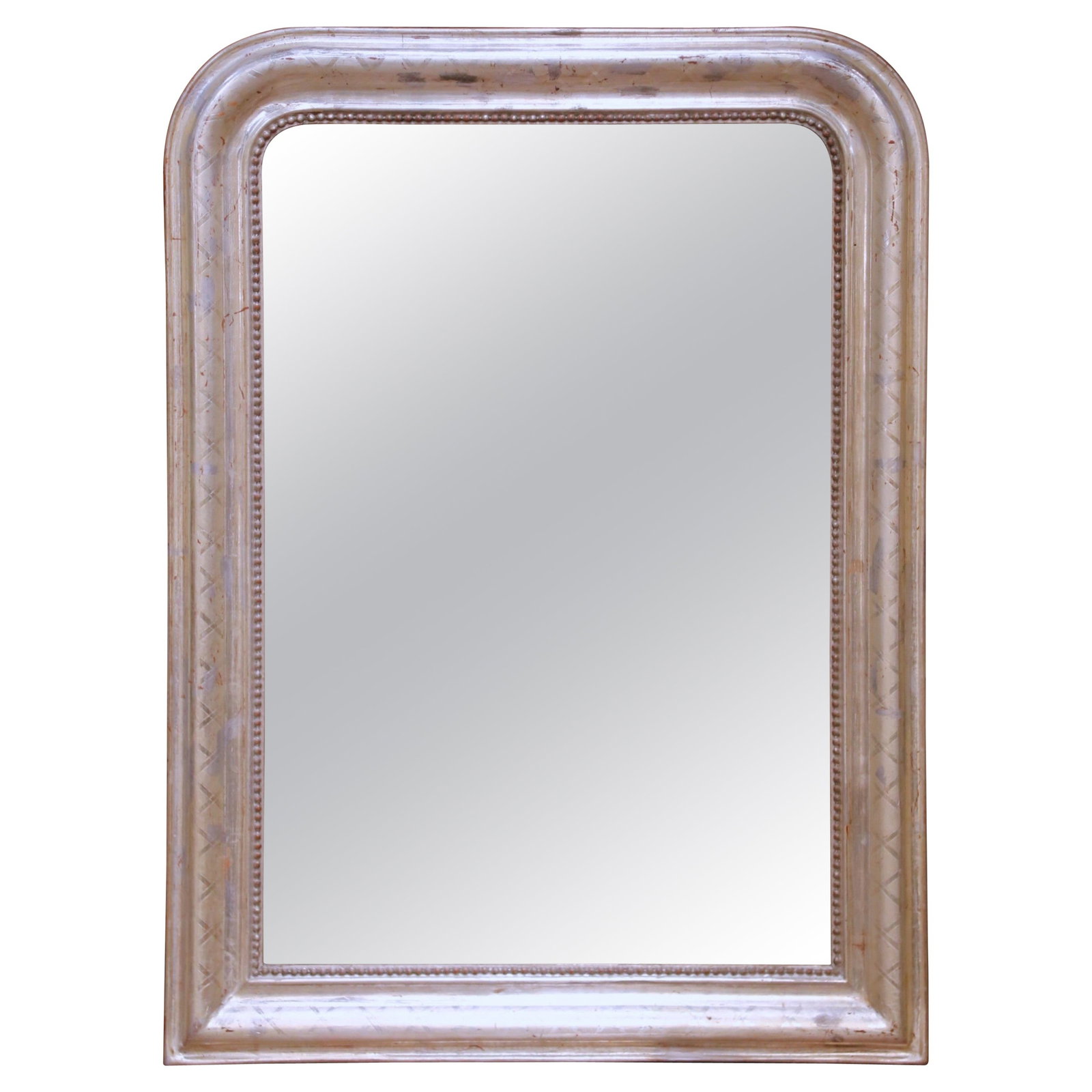 French Louis Philippe Mercury Glass Mirror With Silver Leaf Frame Circa 1870: French Louis Philippe Mercury Glass Mirror With Silver Leaf Frame Circa 1870 This mid-19th century French Louis Philippe wall mirror showcases a classic rounded rectangular silhouette with gently curv
