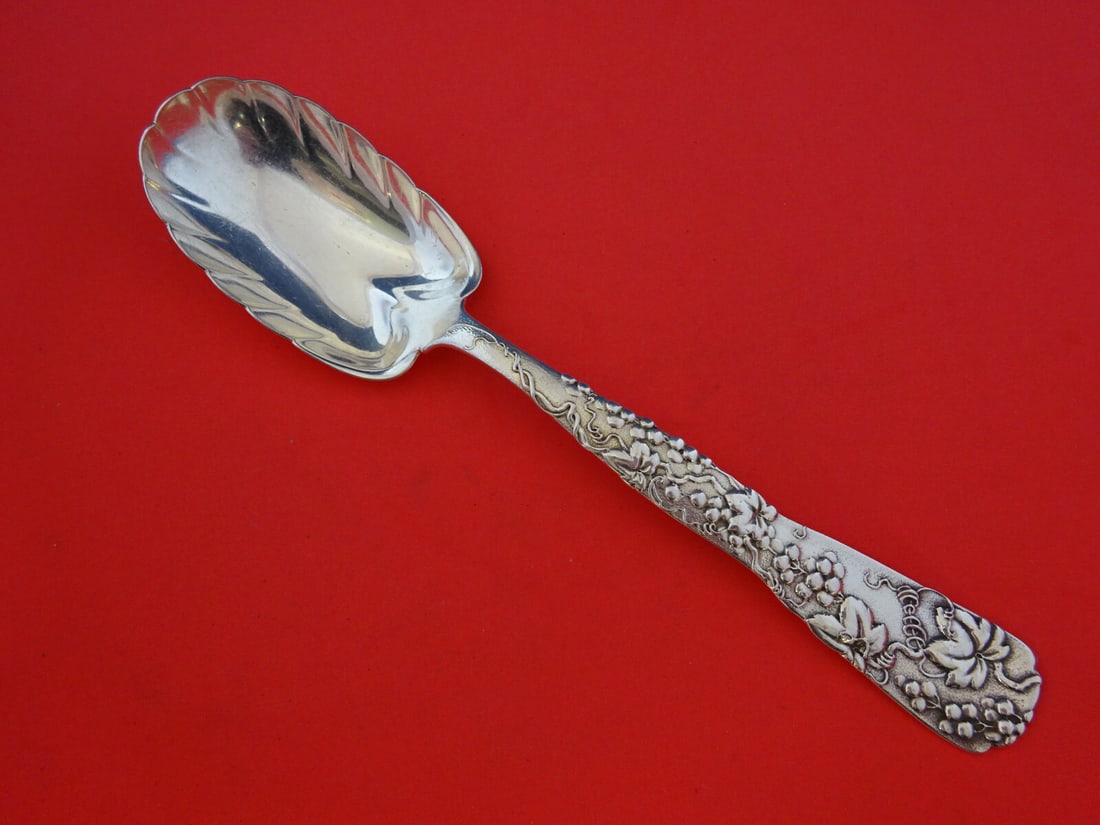 Tiffany & Co Vine Sterling Silver Berry Spoon Leaf Grapevine 8 3/4": Tiffany & Co Vine Sterling Silver Berry Spoon Leaf Grapevine 8 3/4" This exquisite serving spoon from Tiffany & Co. features a stunning vine motif with a leaf shape and grapes, showcasing the brand's 