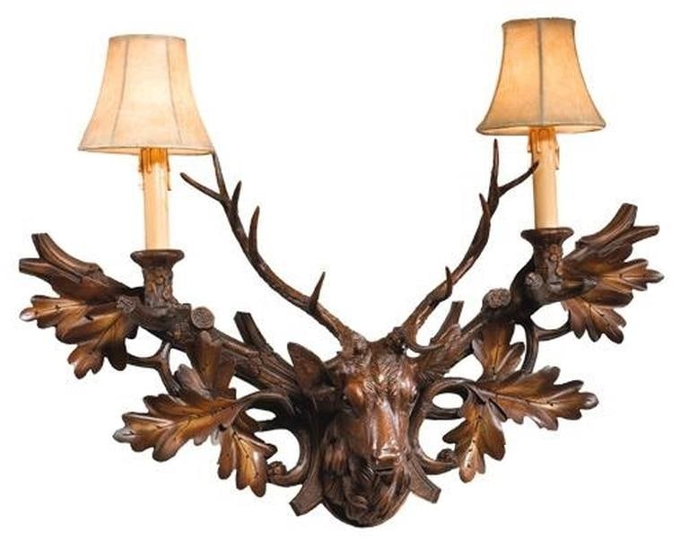 Rustic Lodge Style Stag Wall Sconce Chestnut Finish: Rustic Lodge Style Stag Wall Sconce Chestnut Finish This item is made at time of order. Please allow 42 to 70 days for production. Illuminate your space with this Lodge Style Stag Bookcase Sconce, des