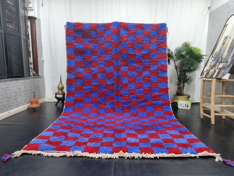 Handmade Moroccan Berber Wool Rug Blue Red Chess Design 9.84 x 6.56 Feet: Handmade Moroccan Berber Wool Rug Blue Red Chess Design 9.84 x 6.56 Feet Experience the warmth and charm of this Soft Blue & Red Chess Handmade Moroccan Berber Wool Rug. Crafted by skilled Berber