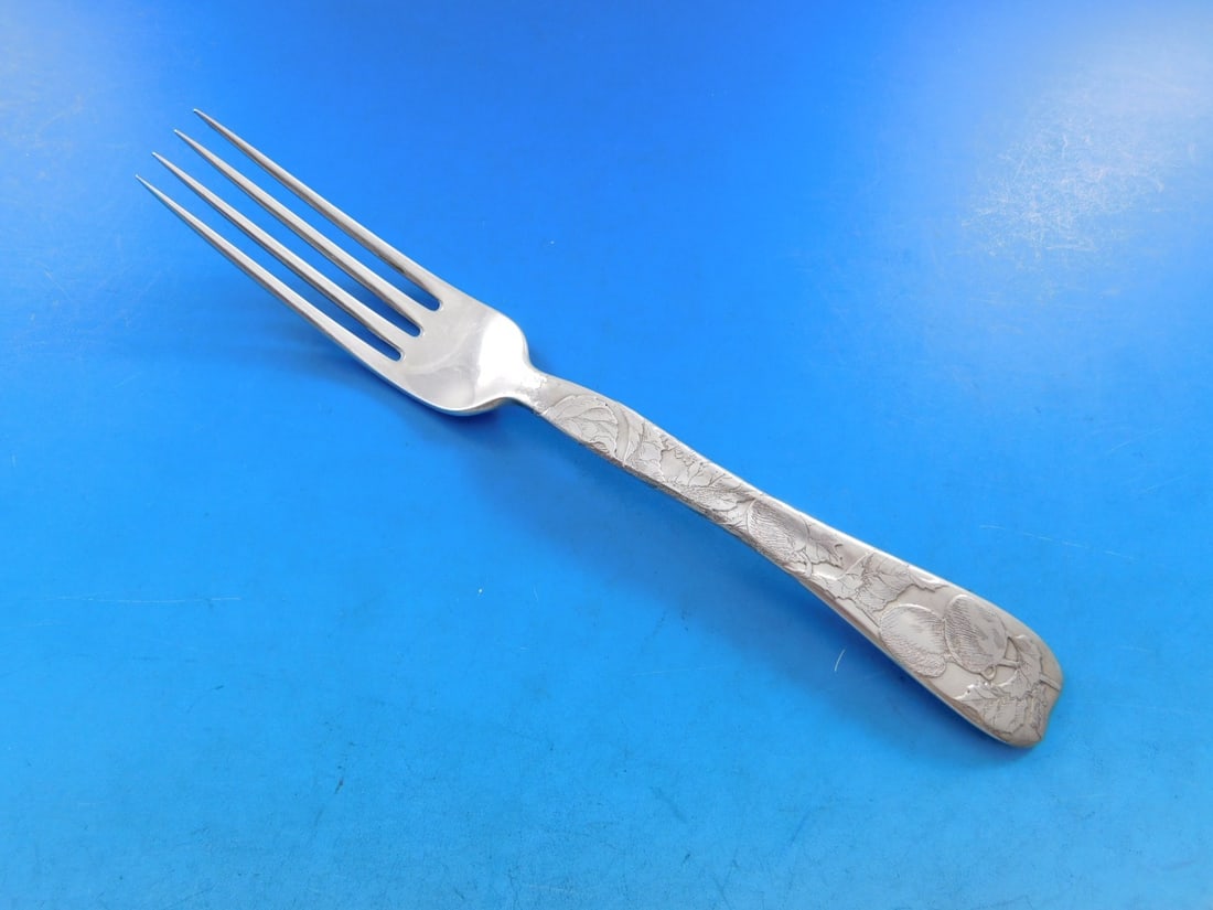 Tiffany & Co. Lap Over Edge Sterling Silver Fork Plums 7 1/4": Tiffany & Co. Lap Over Edge Sterling Silver Fork Plums 7 1/4" This stunning regular fork, crafted by Tiffany & Co., features the elegant Lap Over Edge pattern and showcases a beautiful plum motif thro