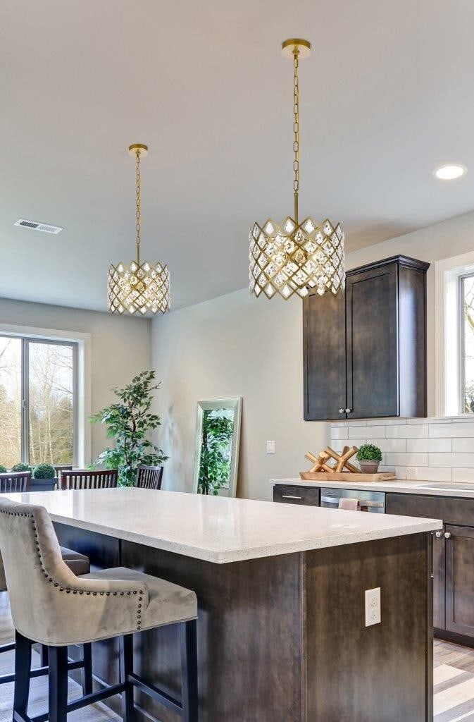 Lyla Modern Brass Chandelier with 3 Crystal Lights 13 Inch Round Pendant: Lyla Modern Brass Chandelier with 3 Crystal Lights 13 Inch Round Pendant This modern chandelier features a round brass-finished metal frame adorned with crystal and glass elements. Designed with three
