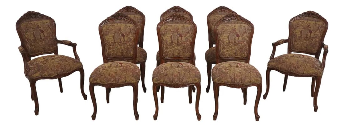 Eight Walnut Dining Chairs with Upholstered Seats and French Carved Detailing Set of 8: Eight Walnut Dining Chairs with Upholstered Seats and French Carved Detailing Set of 8 This set of 8 French style dining room chairs features intricately carved rose motifs at the top of each chair. T