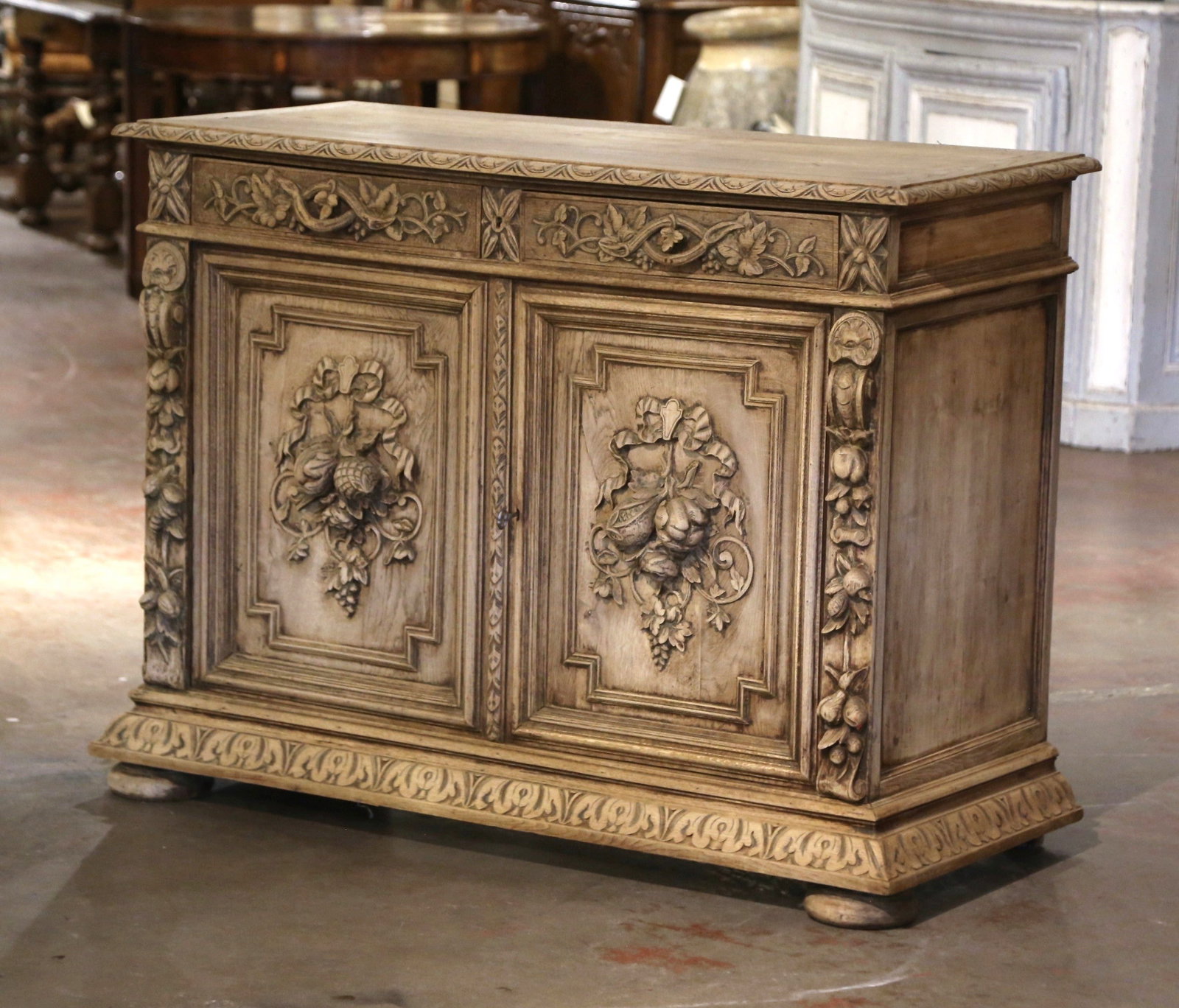 19th Century French Black Forest Bleached Oak Buffet with Floral Carvings: 19th Century French Black Forest Bleached Oak Buffet with Floral Carvings This exquisite 19th Century French Black Forest buffet is a stunning showcase of craftsmanship and design. Crafted from bleach