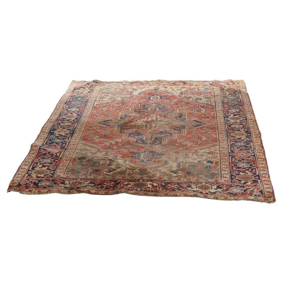 Heriz Geometric Wool Rug Early 20th Century Persian 107.5 x 72.75 in: Heriz Geometric Wool Rug Early 20th Century Persian 107.5 x 72.75 in This antique Heriz Persian rug from circa 1930 features traditional geometric patterns and a rich color palette characteristic of H