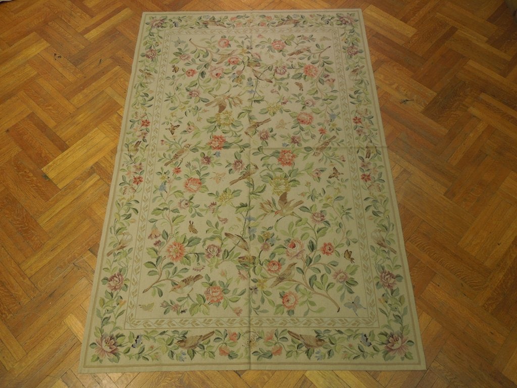 6 x 9 Birds Butterfly Hand-Knotted Needlepoint Area Rug: 6 x 9 Birds Butterfly Hand-Knotted Needlepoint Area Rug Free continental US Shipping Enhance your home decor with the 6' x 9' Birds Butterfly Needlepoint Flat Weave Rug. This exquisite area rug featur
