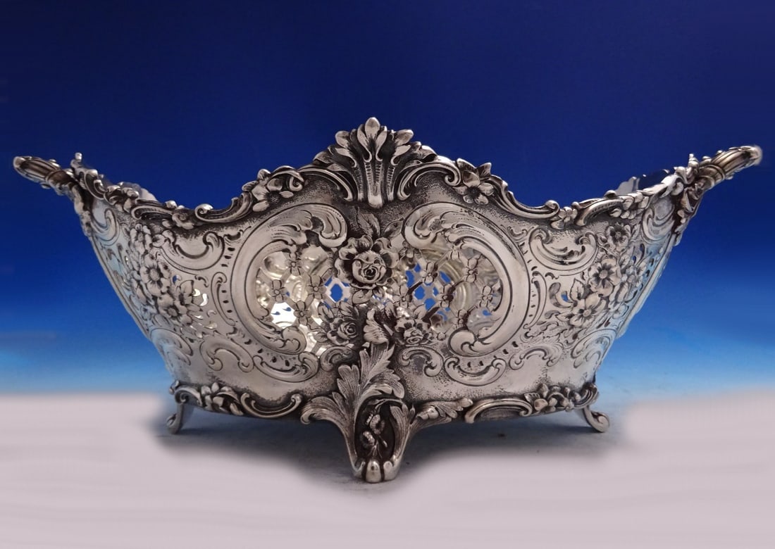 Sterling Silver Footed Centerpiece Bowl with Pierced Lattice by Tiffany: Sterling Silver Footed Centerpiece Bowl with Pierced Lattice by Tiffany This Tiffany & Co. sterling silver centerpiece bowl features a pierced lattice design, repoussed floral motifs, applied top and 