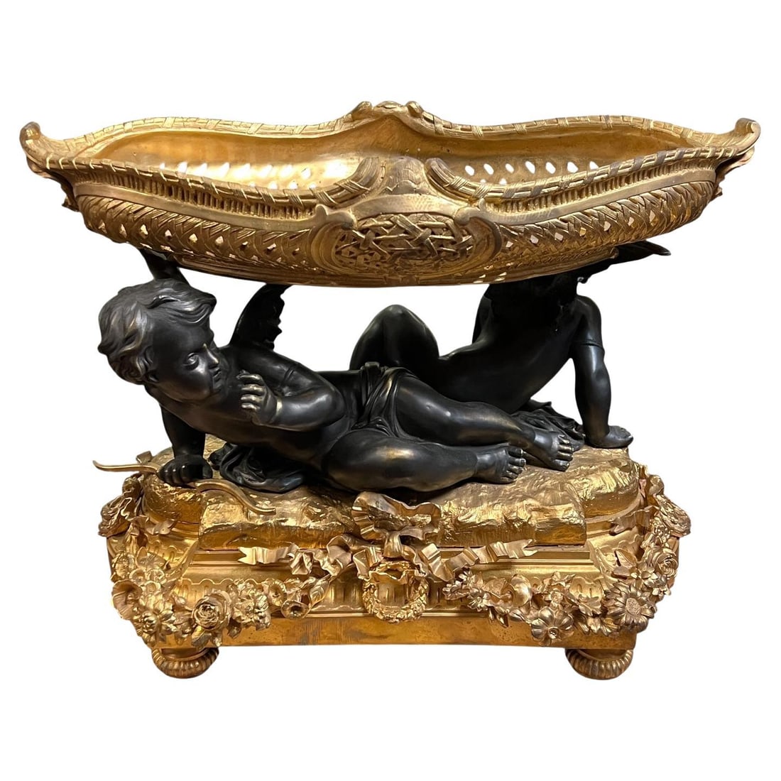 French Ormolu and Patinated Bronze Jardiniere in Louis XVI Tradition After Moreau: French Ormolu and Patinated Bronze Jardiniere in Louis XVI Tradition After Moreau This 19th century Louis XVI style jardiniere or centerpiece is finely cast in patinated and gilt bronze. Inspired by t
